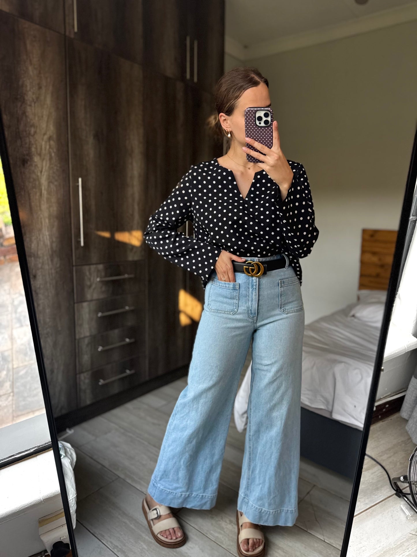 Black polka dot top (E)