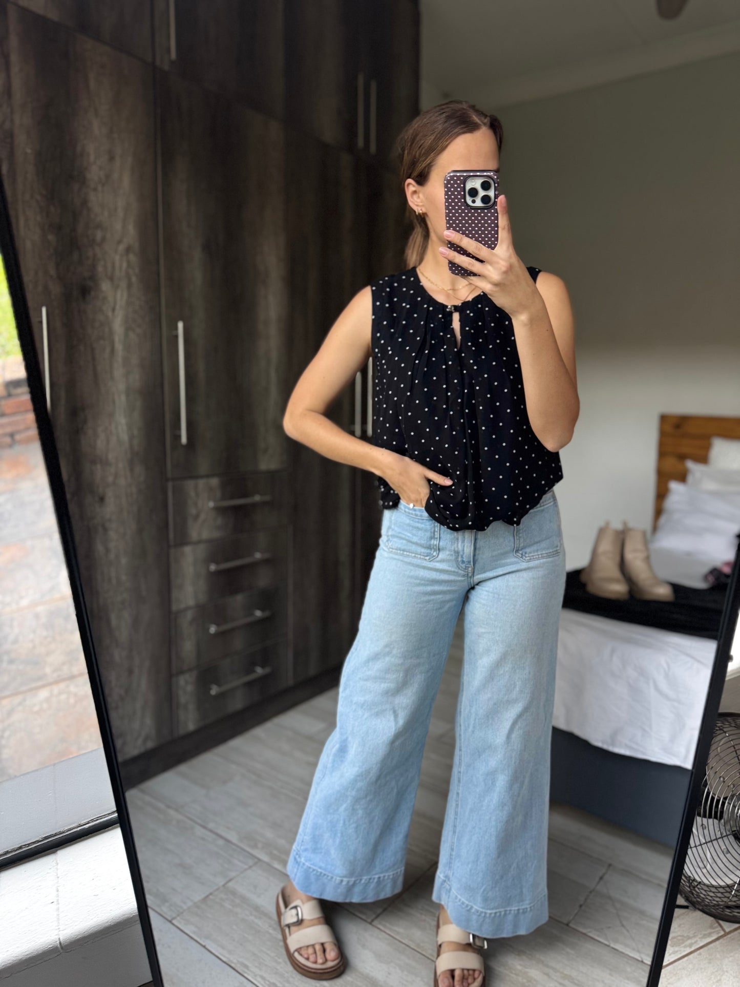 Black polka dot top (E)